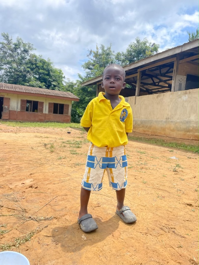 Student standing in a school yard