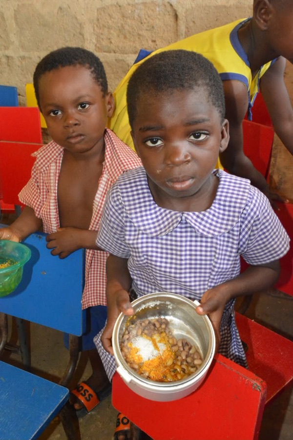 Student holding a school meal