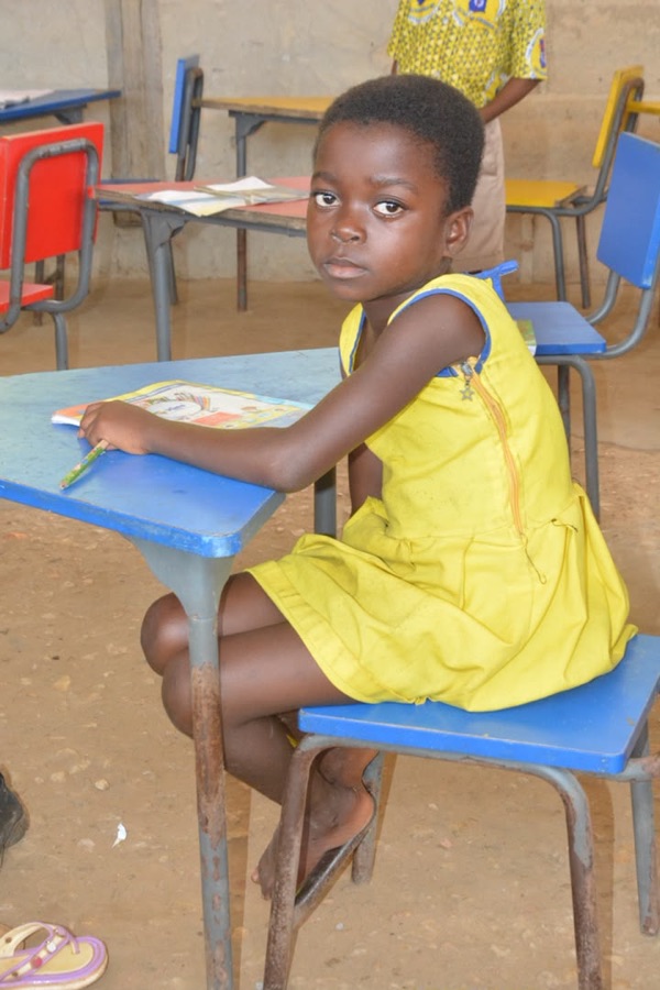 Student seated at a classroom desk